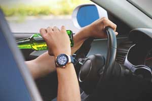 Person Drinking and Driving