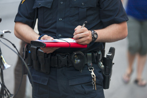 Police officer writting something down